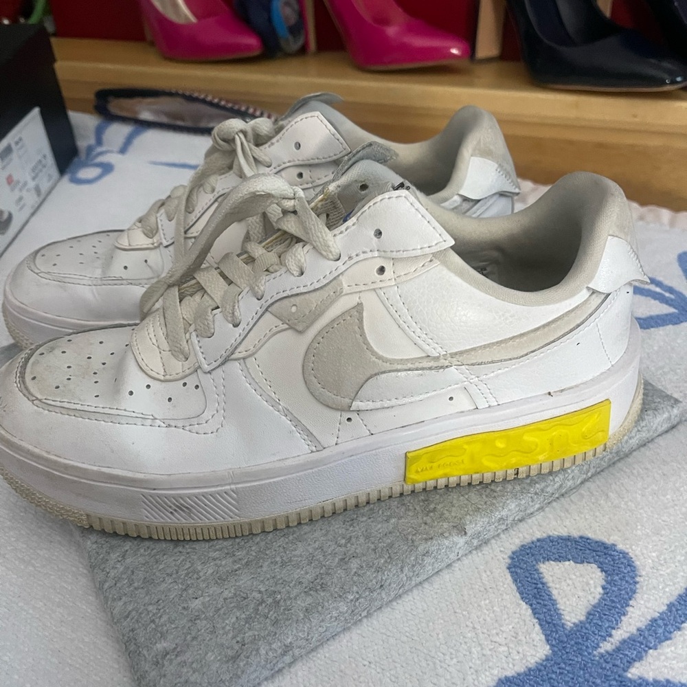 Nike Air Force One White Sneakers with Yellow Accent